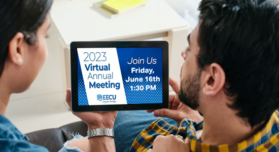 A couple watching the EECU Virtual Annual Meeting from home