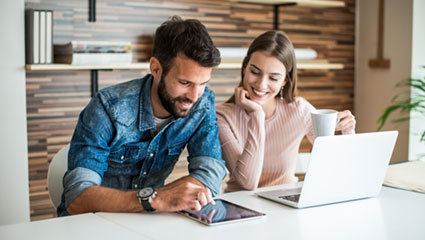 Couple viewing laptop