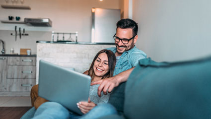 Young couple looking at laptop