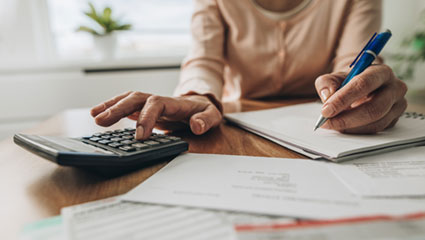 Woman using calculator