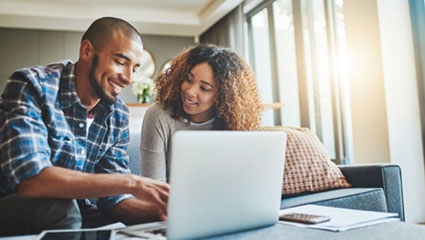 Couple viewing laptop