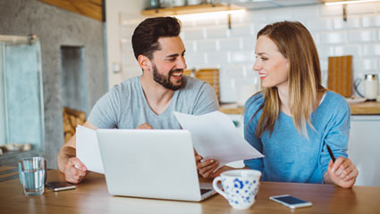 Couple viewing laptop