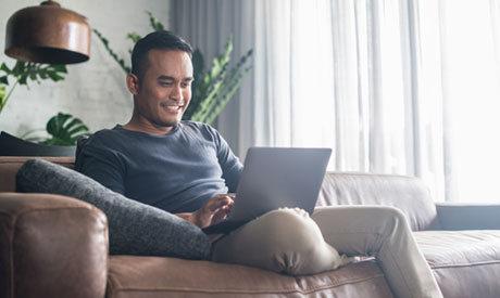 Man reading laptop