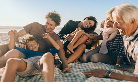 Family playing on the beach