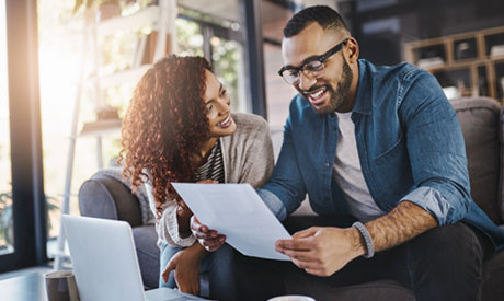 Young couple reviewing document