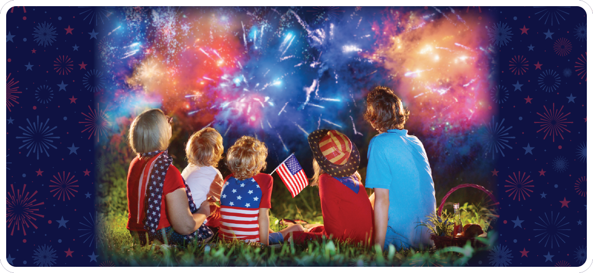 family sitting watching fireworks